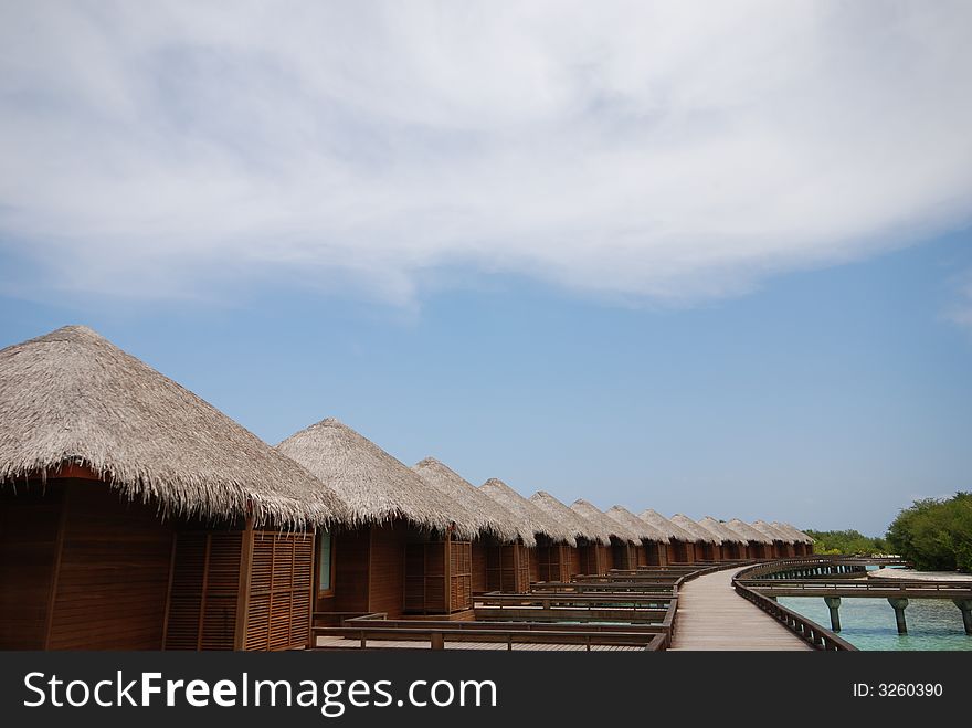 A passage in front of water bungalows on Full Moon Island, Maldives