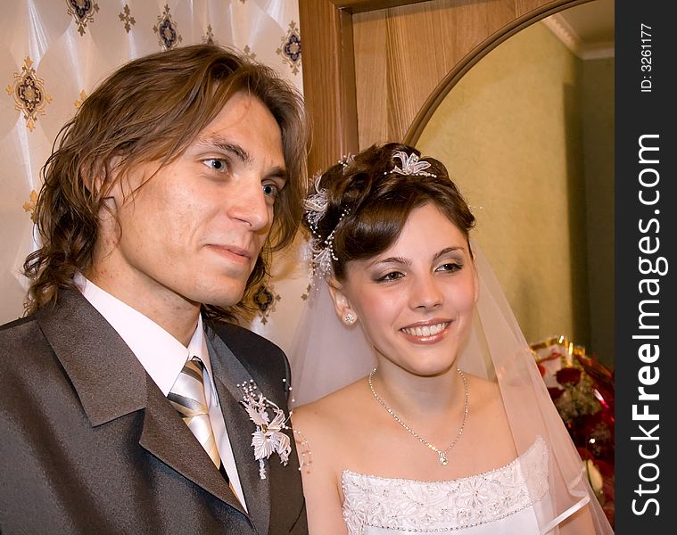 Bride with bridegroom against a background of  a mirror. Bride with bridegroom against a background of  a mirror