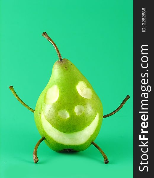 Abstract composition: cheerful pear on green background