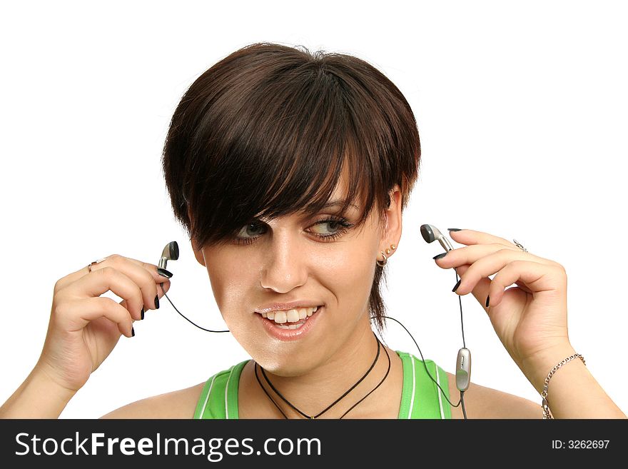 A smiling young girl with mobile's headphones, isolated on white