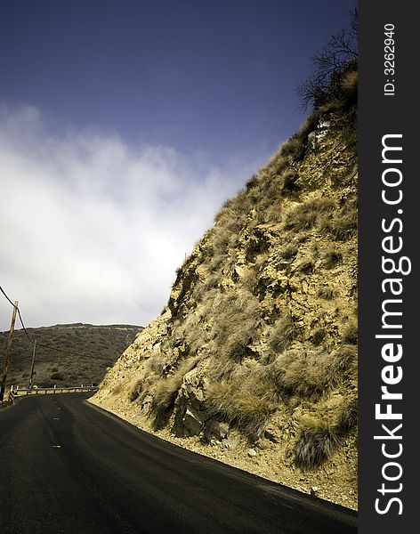 Contrasting colors wrap around this blacktopped road. Contrasting colors wrap around this blacktopped road