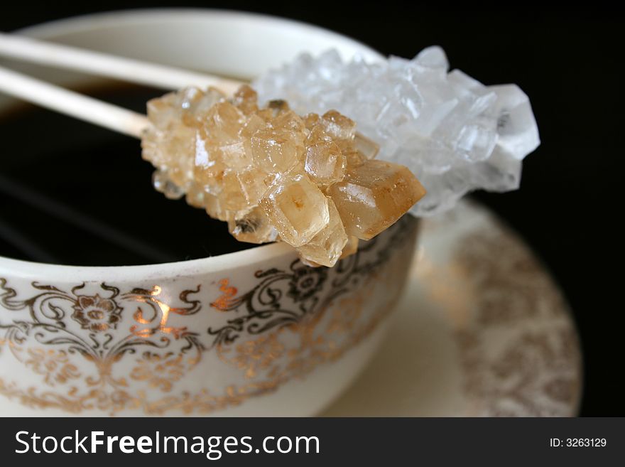 Antique tea cup with sugar crystals on sticks. Antique tea cup with sugar crystals on sticks