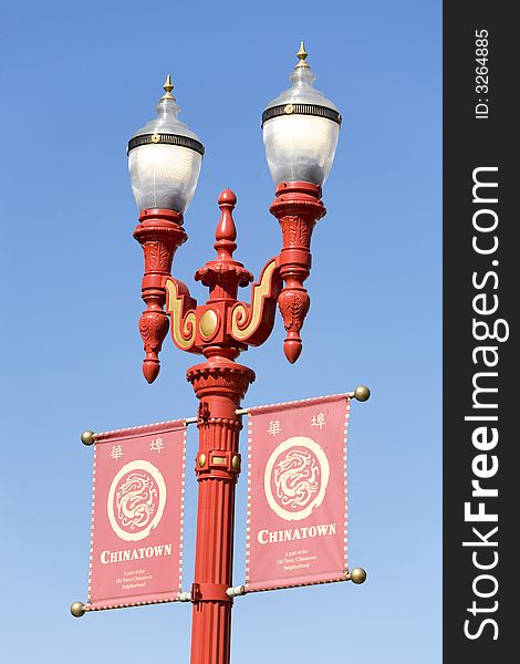 Red gas lamp with banners in Chinatown, San Francisco, California. Red gas lamp with banners in Chinatown, San Francisco, California