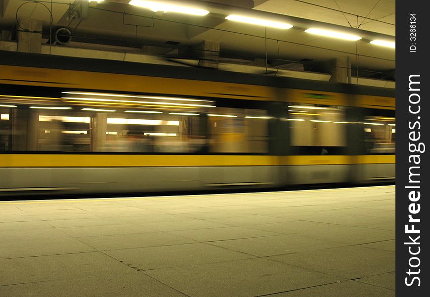 Train passing in subway station