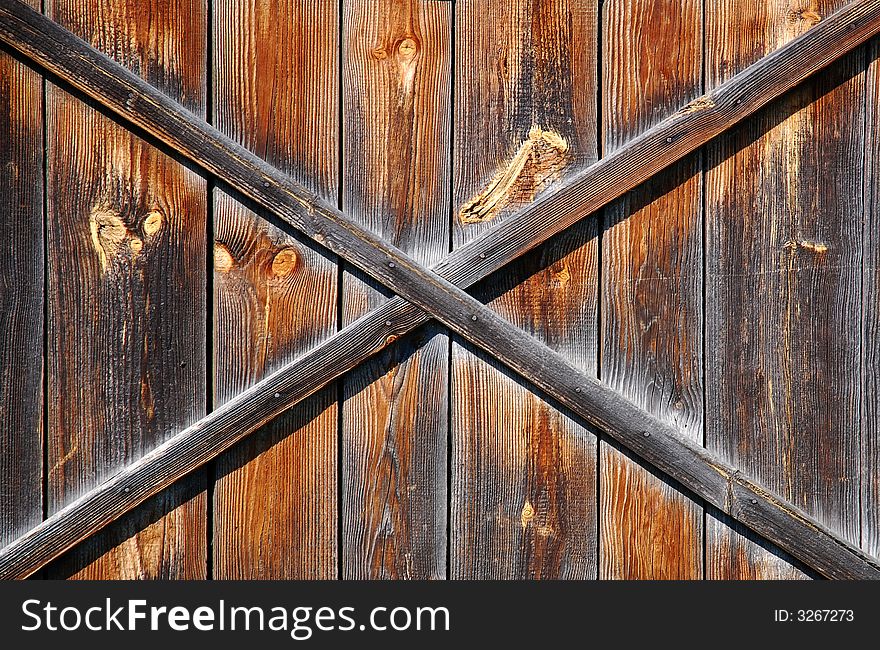 Old scratched wooden brown background. Old scratched wooden brown background