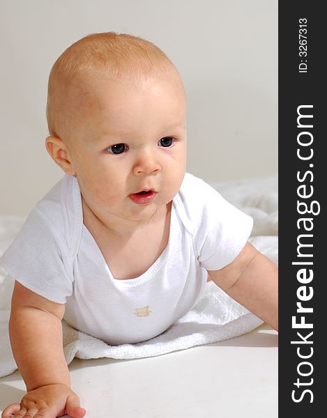 A charming portrait of a little baby boy.  He is 6 months old in this series. A charming portrait of a little baby boy.  He is 6 months old in this series.