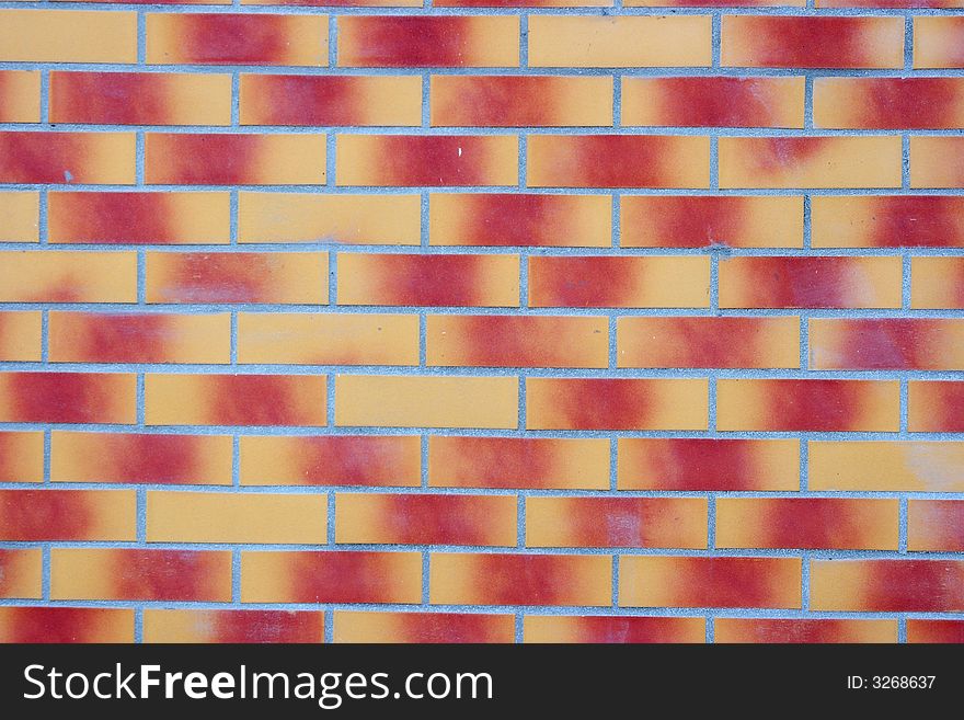 Brick wall with red-yellow gradient color bricks. Brick wall with red-yellow gradient color bricks