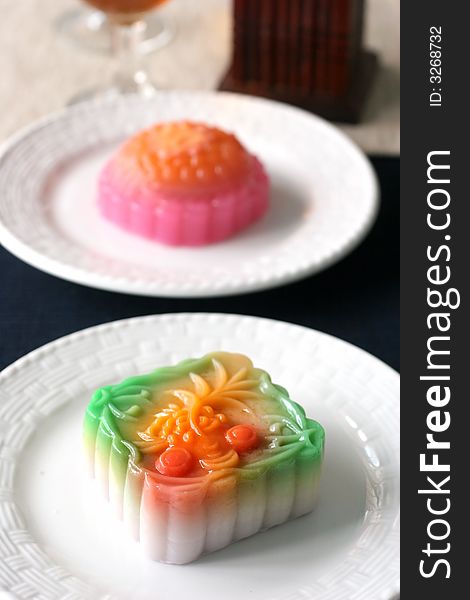 Colorful fruit flavored mooncakes with goldfish patterns signifying prosperity and wealth. Colorful fruit flavored mooncakes with goldfish patterns signifying prosperity and wealth