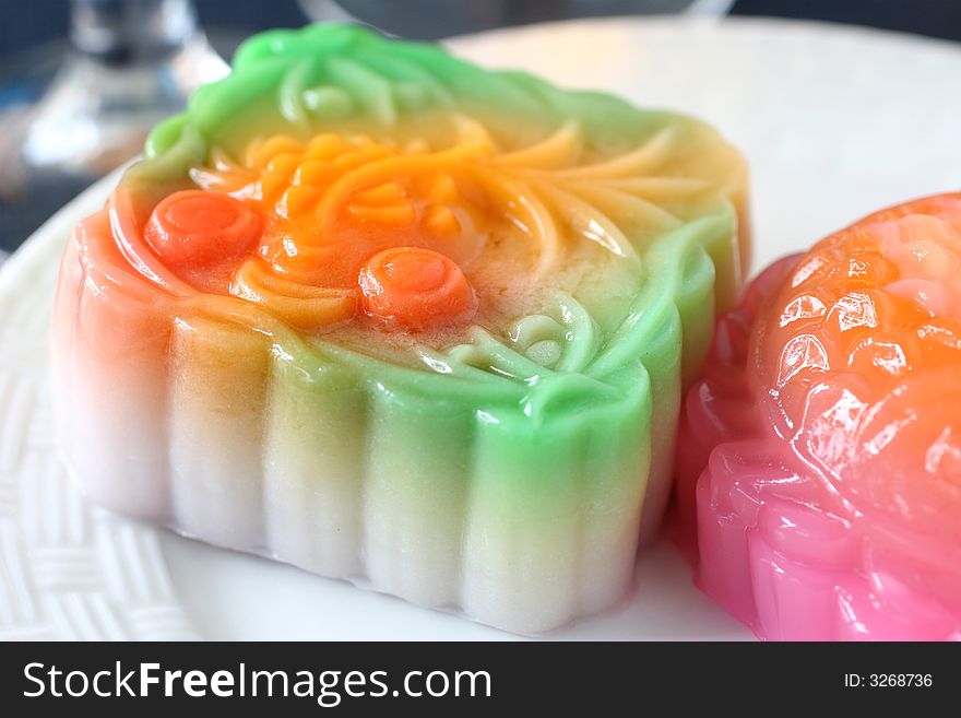 Colorful fruit flavored mooncakes with goldfish patterns signifying prosperity and wealth. Colorful fruit flavored mooncakes with goldfish patterns signifying prosperity and wealth