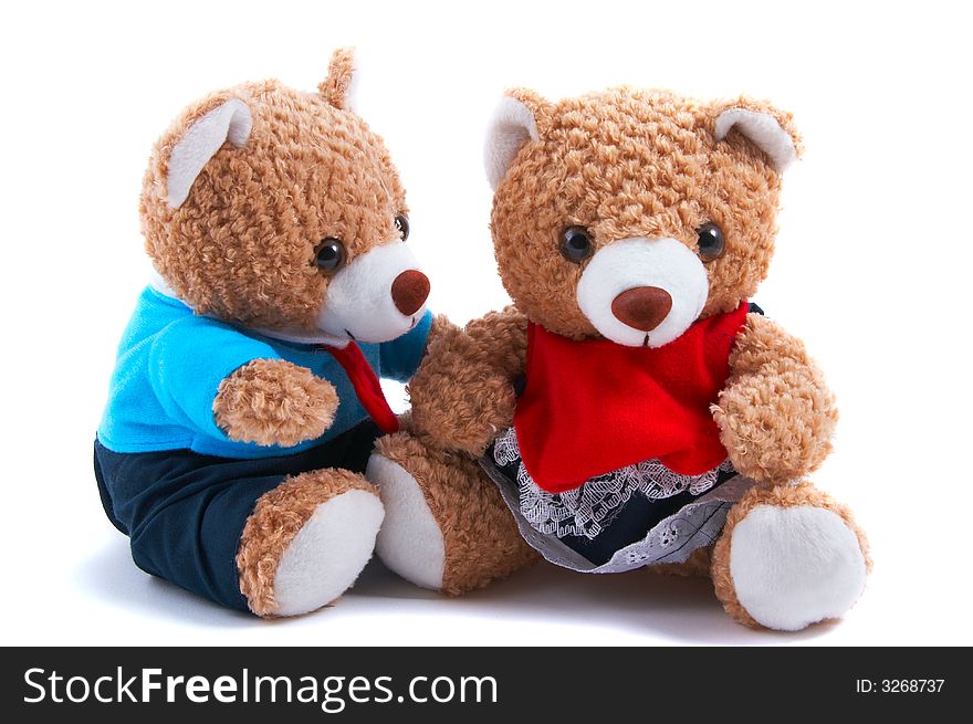 Teddy bears dress up as a couple, with shirt and tie and frilly dress. Boy teddy looking at girl teddy. Teddy bears dress up as a couple, with shirt and tie and frilly dress. Boy teddy looking at girl teddy.
