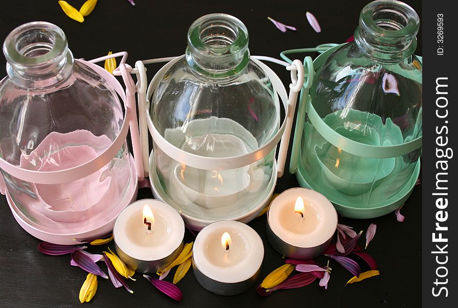 White, Pink and green bottle style lanterns with tee lights