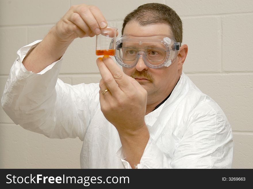 Forensic scientist working on a experiment in the lab. Forensic scientist working on a experiment in the lab.