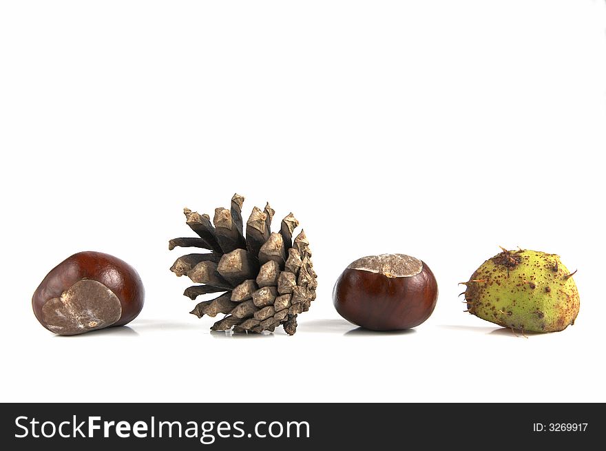 Composition of crone and chestnuts isolated on white background