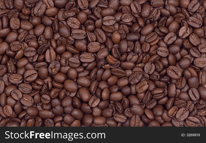 Coffee background with close up  of coffee beans in whole frame