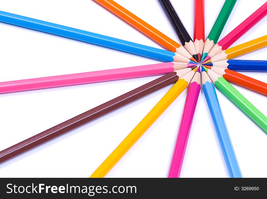 Circle of multicoloured crayons - center top-right