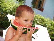 Baby Eat Watermelon In Garden Stock Images
