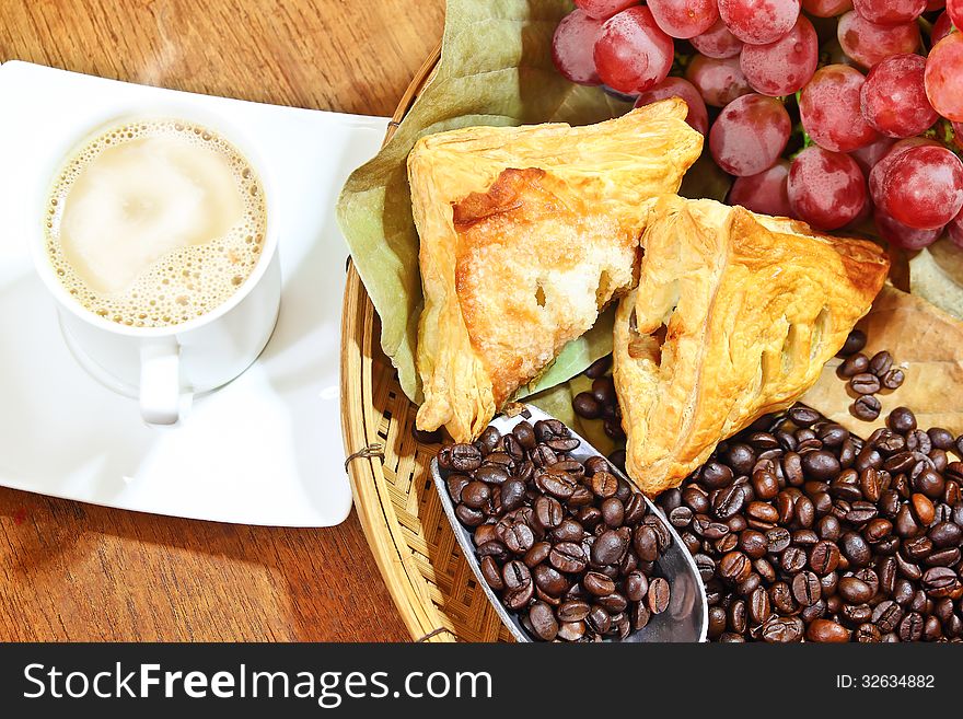 Pie with coffee and grapes food background