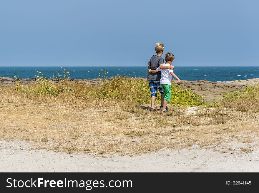 Two boys having a beautiful day at the beach. Two boys having a beautiful day at the beach