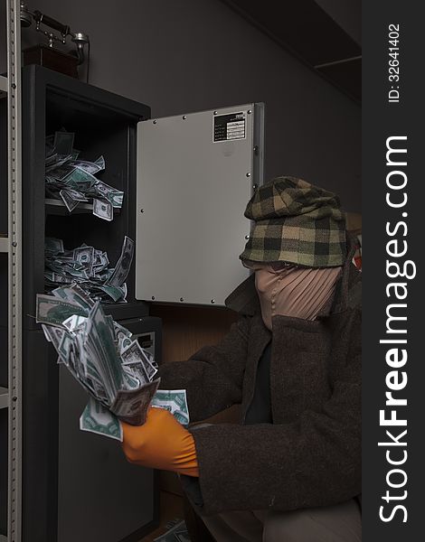 A Thief Steals Money From The Safe