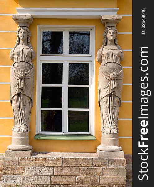 Window with sculptures in the form of ancient women