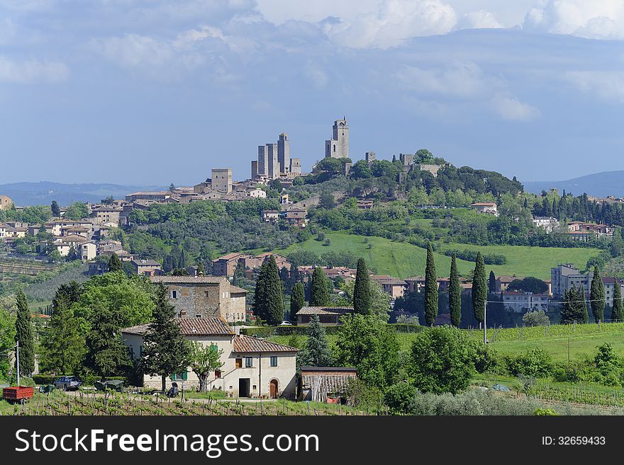 Panoramic view of the ancient town of San Gimignano in the Tuscany area of Italy. The place is famous for its medieval tower houses which were erected to show the power of the ruling families. Fourteen of the originally about 70 towers are still standing and make San Gimignano a UNESCO World Heritage Site.