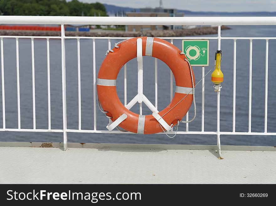 Next to lifeboats life buoys belong to the essential life saving equipment on ships like the one here on a ferry boat in Norway. Next to lifeboats life buoys belong to the essential life saving equipment on ships like the one here on a ferry boat in Norway.