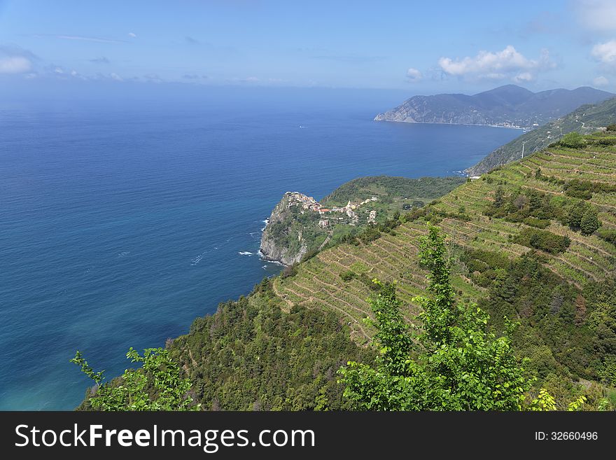 Corniglia is part of the commune of Vernazza in the province of La Spezia in Liguria in northern Italy. Unlike the other localities of the Cinque Terre, Corniglia is not directly adjacent to the sea. Instead, it is on the top of a promontory about 100 metres high, surrounded on three sides by vineyards and terraces and the fourth side descends steeply to the sea. Corniglia is part of the commune of Vernazza in the province of La Spezia in Liguria in northern Italy. Unlike the other localities of the Cinque Terre, Corniglia is not directly adjacent to the sea. Instead, it is on the top of a promontory about 100 metres high, surrounded on three sides by vineyards and terraces and the fourth side descends steeply to the sea.