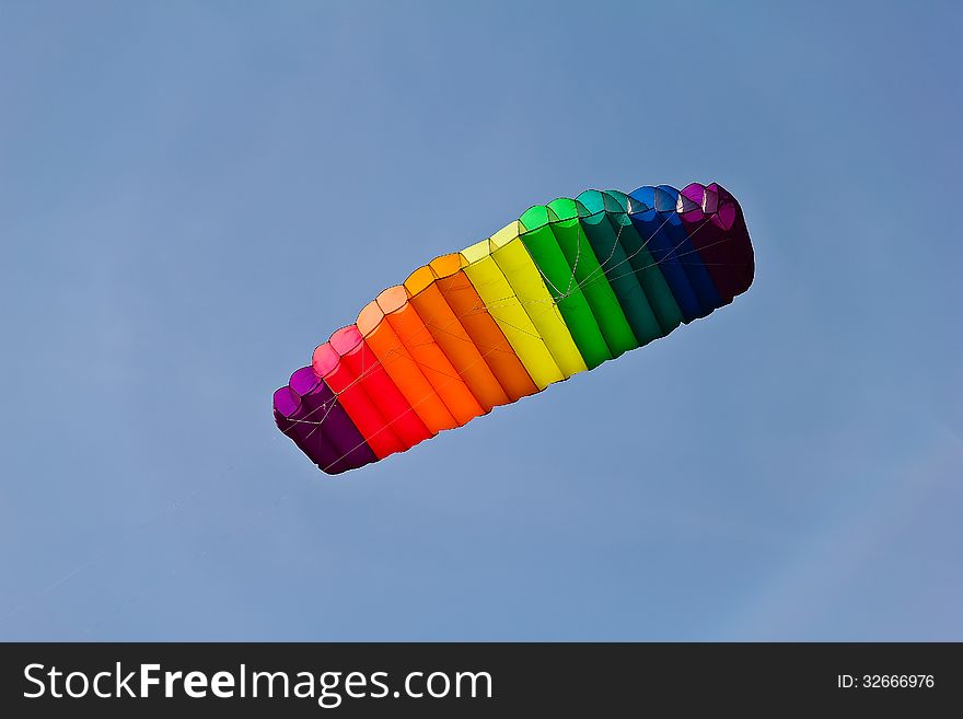 Colorful big kite in blue sky, Thailand