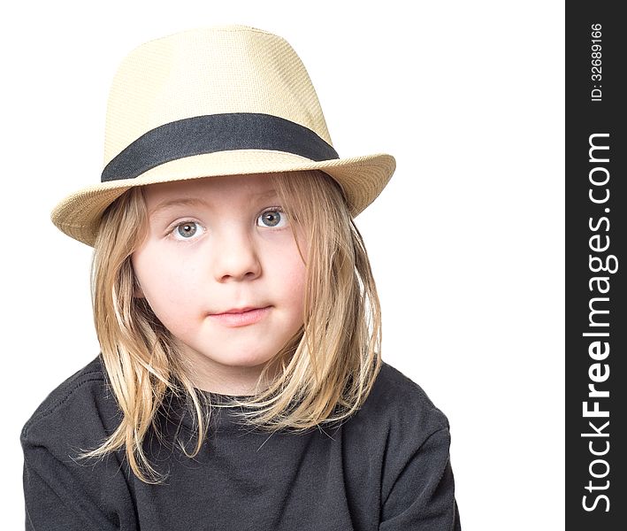 Very cute boy with long blond hair wearing a tan fedora isolated on white