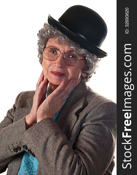 Cheerful elderly woman in a suit and bowler hat isolated on a white