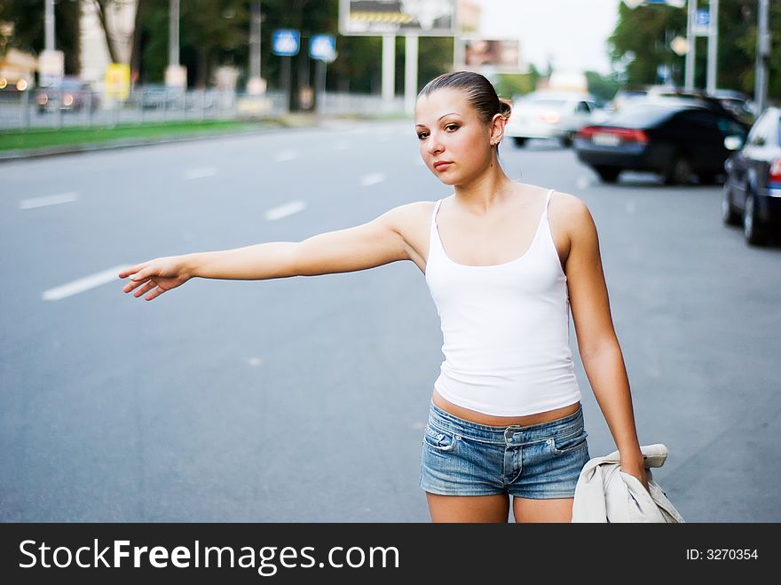 Woman wait for taxi on the road. Woman wait for taxi on the road