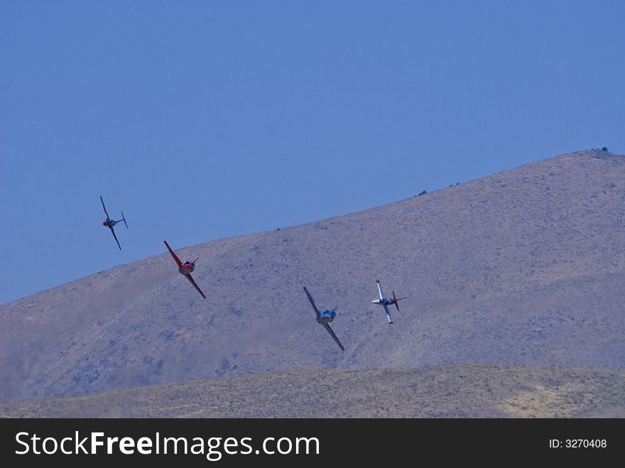 Vintage war bird fighter aircraft in flight at the Reno Air Races. Vintage war bird fighter aircraft in flight at the Reno Air Races