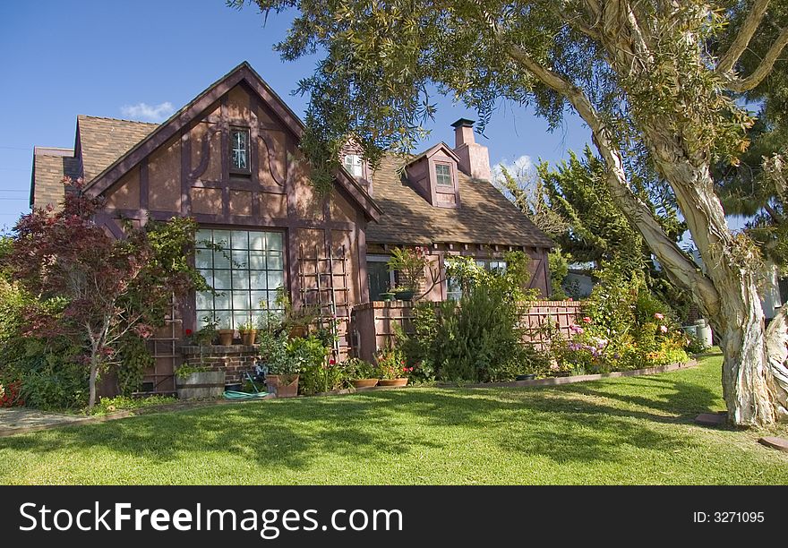 A cottage home in california with a blue sky in the background. A cottage home in california with a blue sky in the background