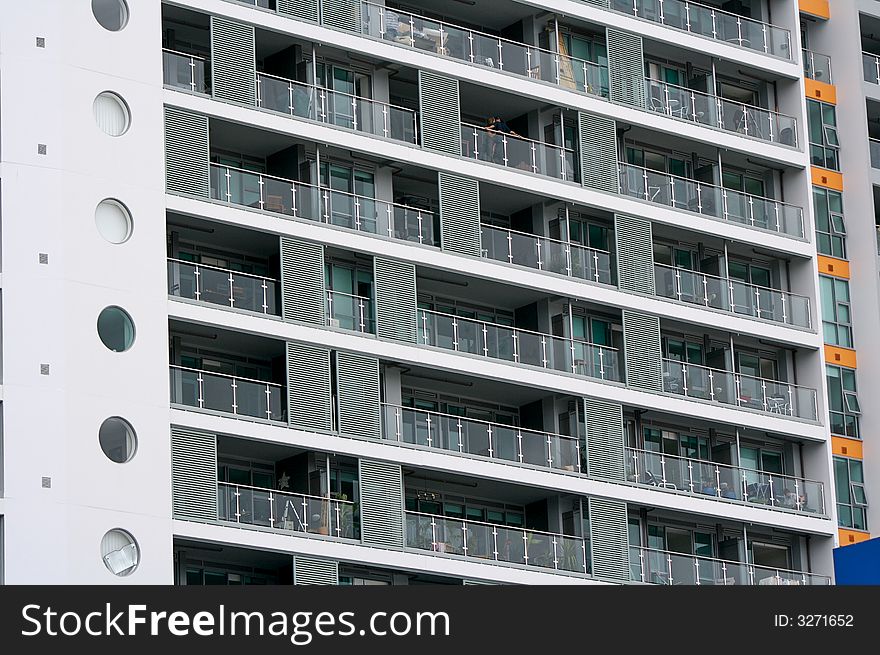 An Apartment building. Balconies, windows etc