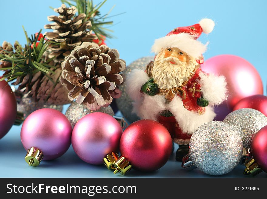 Santa Claus and balls on a blue background.