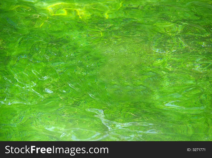 Green water surface. Water texture.
