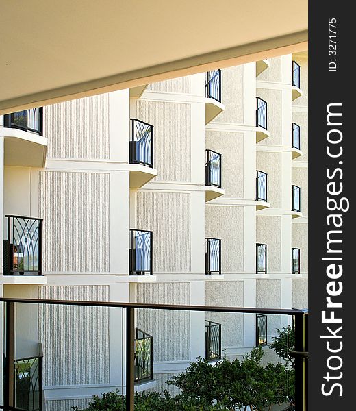 Repetetive geometric angled balconies and neutral concrete walls