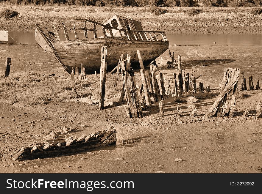 An old boat wreck seen at low tide. An old boat wreck seen at low tide