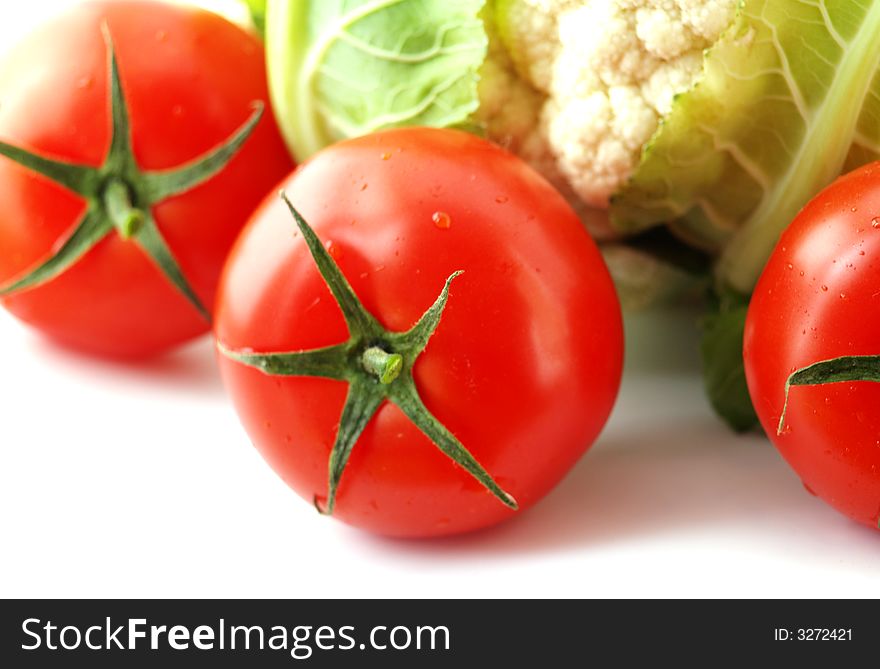Cauliflower with tomatoes isolated on white background
