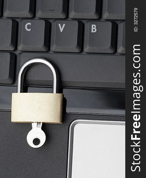 Closed Padlock On A Black Laptop Keyboard, IT Security Concept. Closed Padlock On A Black Laptop Keyboard, IT Security Concept