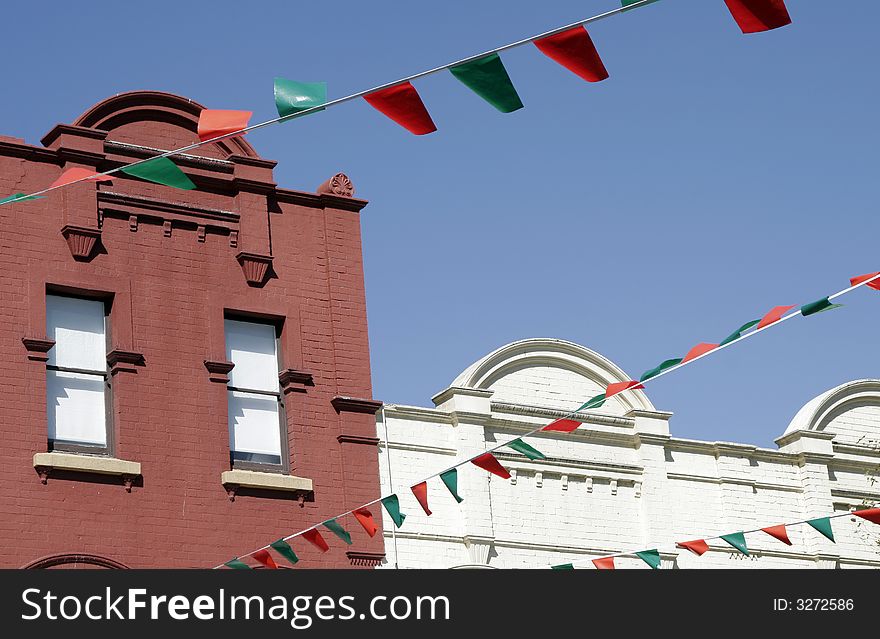 Urban Building Facade, Red And Green Flags As Decoration