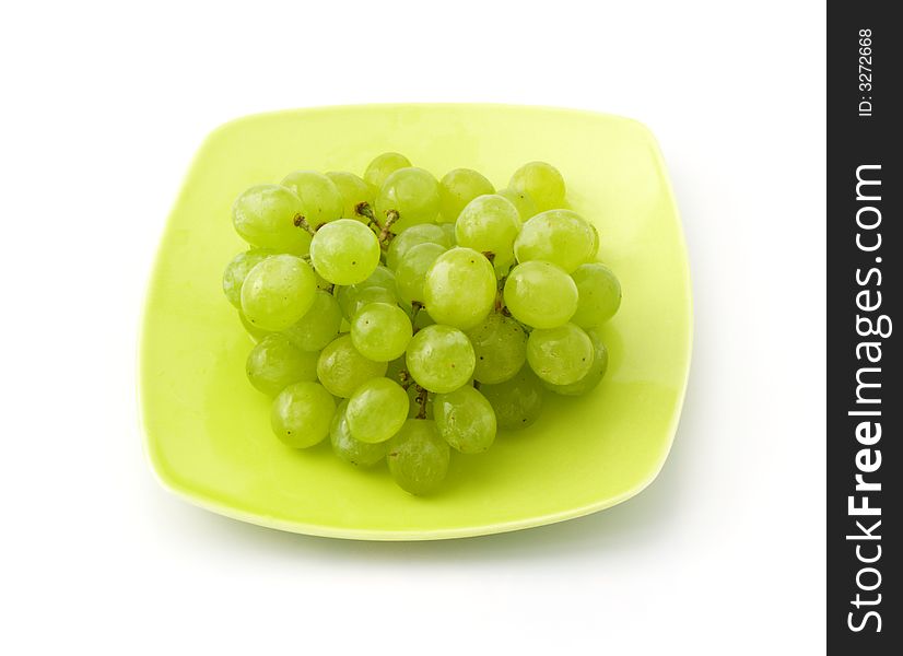 Grape on the saucer isolated on white background