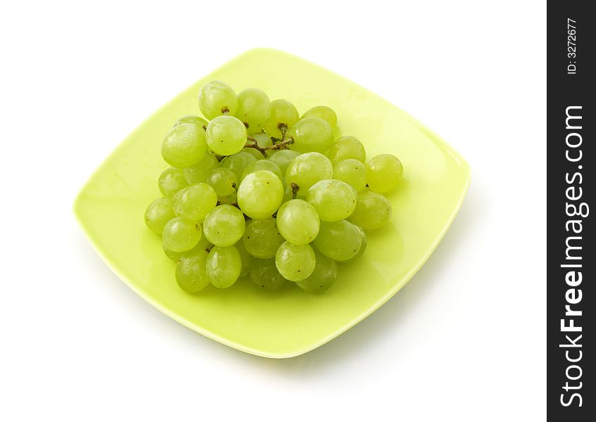 Grape on the saucer isolated on white background