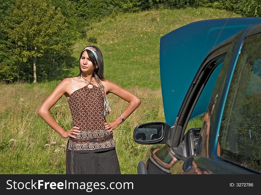 Woman breaking down of car. Woman breaking down of car