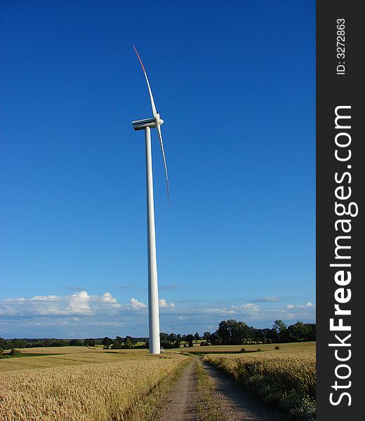 Wind turbine on a hilly field