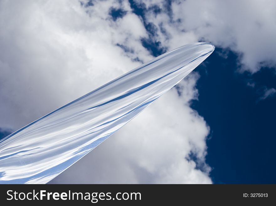 War bird propeller and cloudy blue skies