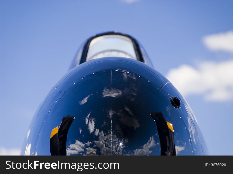 War bird nose cone and cloudy blue skies. War bird nose cone and cloudy blue skies