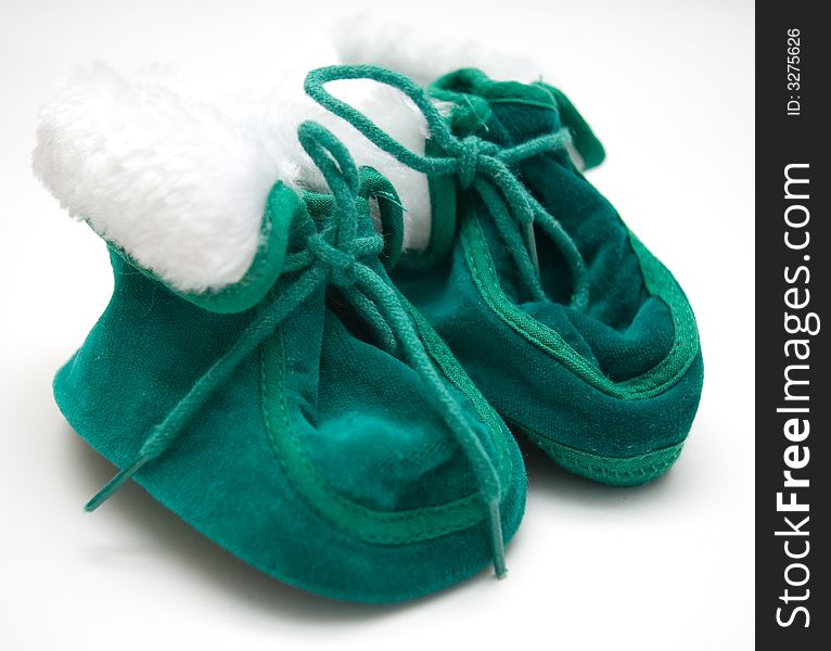 Two little green newborn shoes