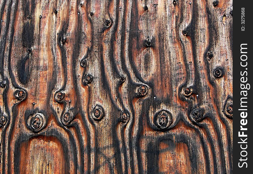 Shot of plywood with knots and unusual grain patterns. Shot of plywood with knots and unusual grain patterns.