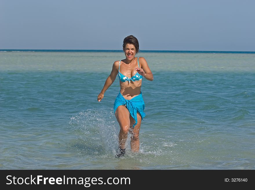 Woman running in the water. Woman running in the water